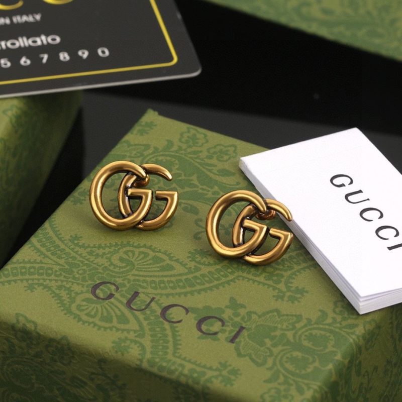 G*u*i earrings